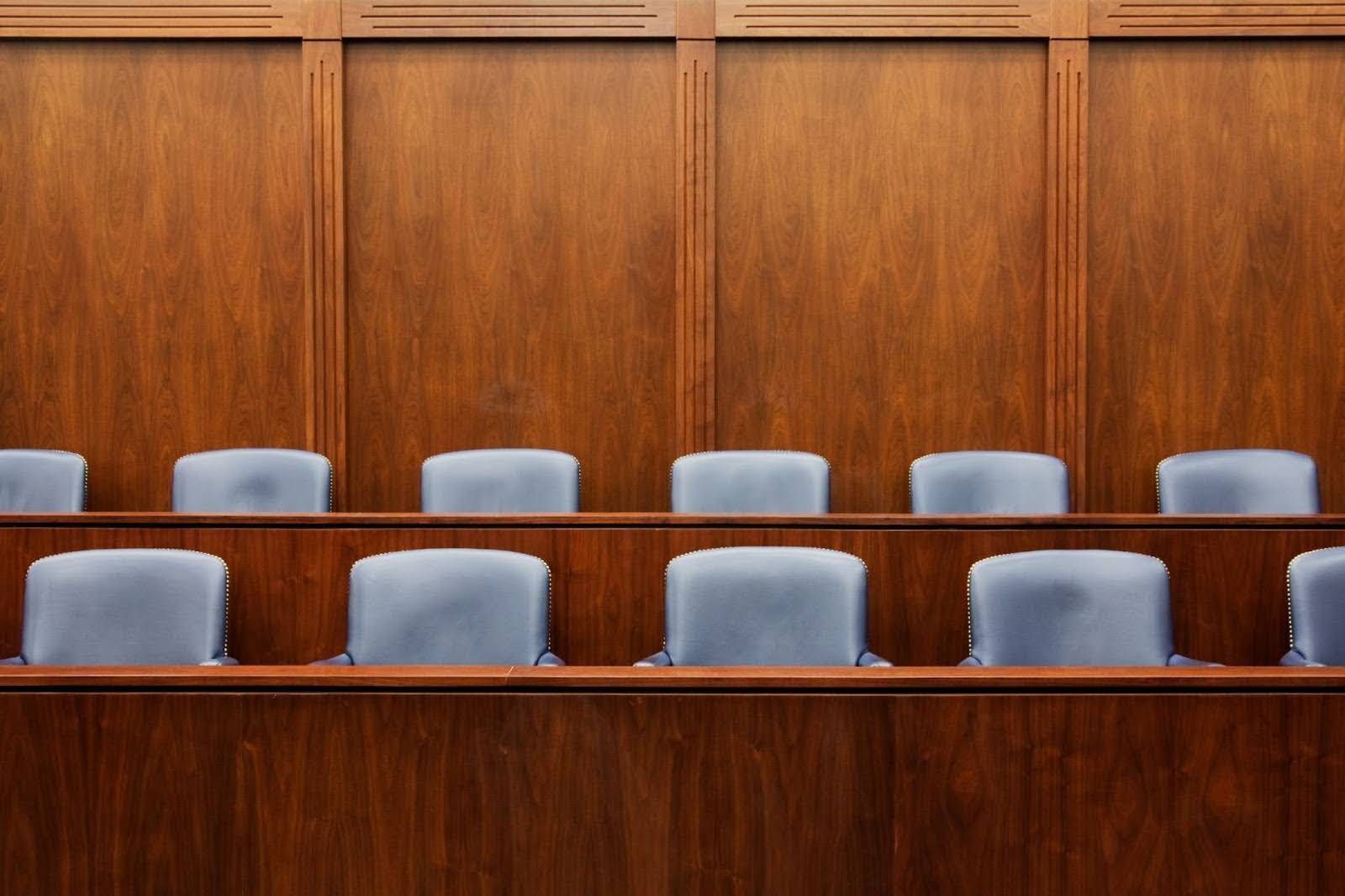 An image of empty jury seats in a courtroom, the people whose heads you are trying to get into with a legal focus group.