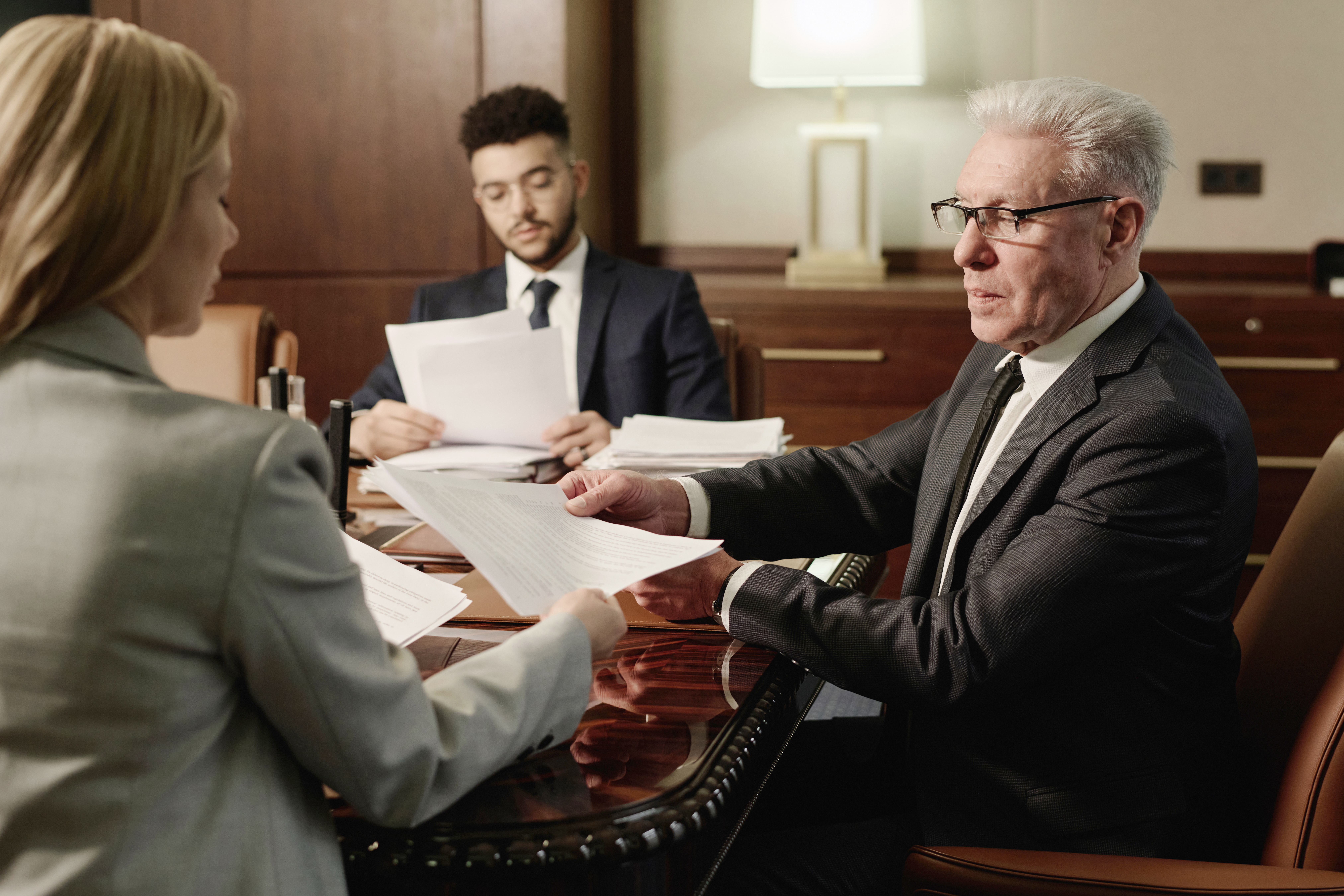 Lawyers exchanging and gathering information, one of the most important tips for dealing with insurance adjusters to have in your toolbox.