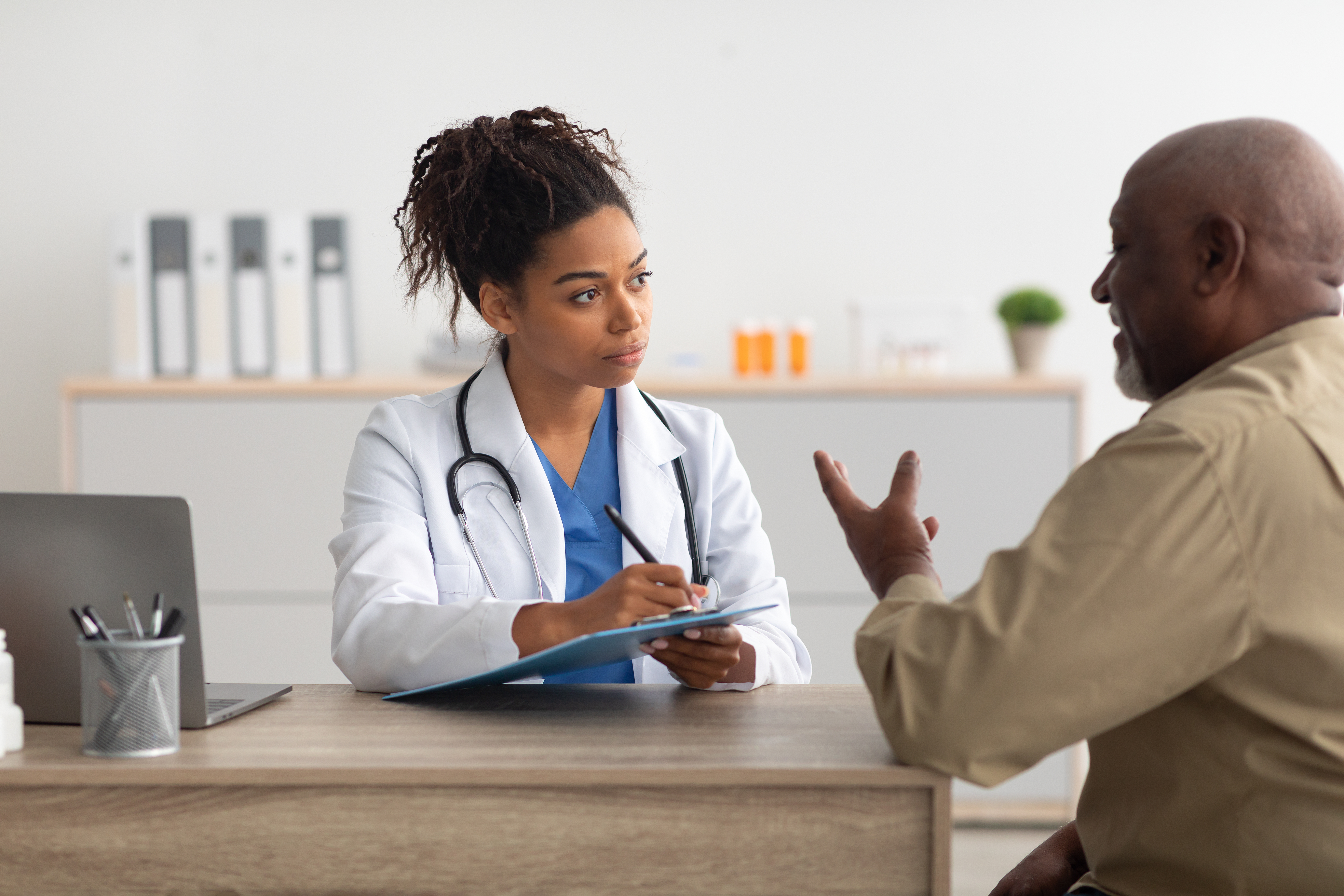 A victim talking to a doctor after her attorney advised her to seek medical attention, an essential component of personal injury case management in Georgia.